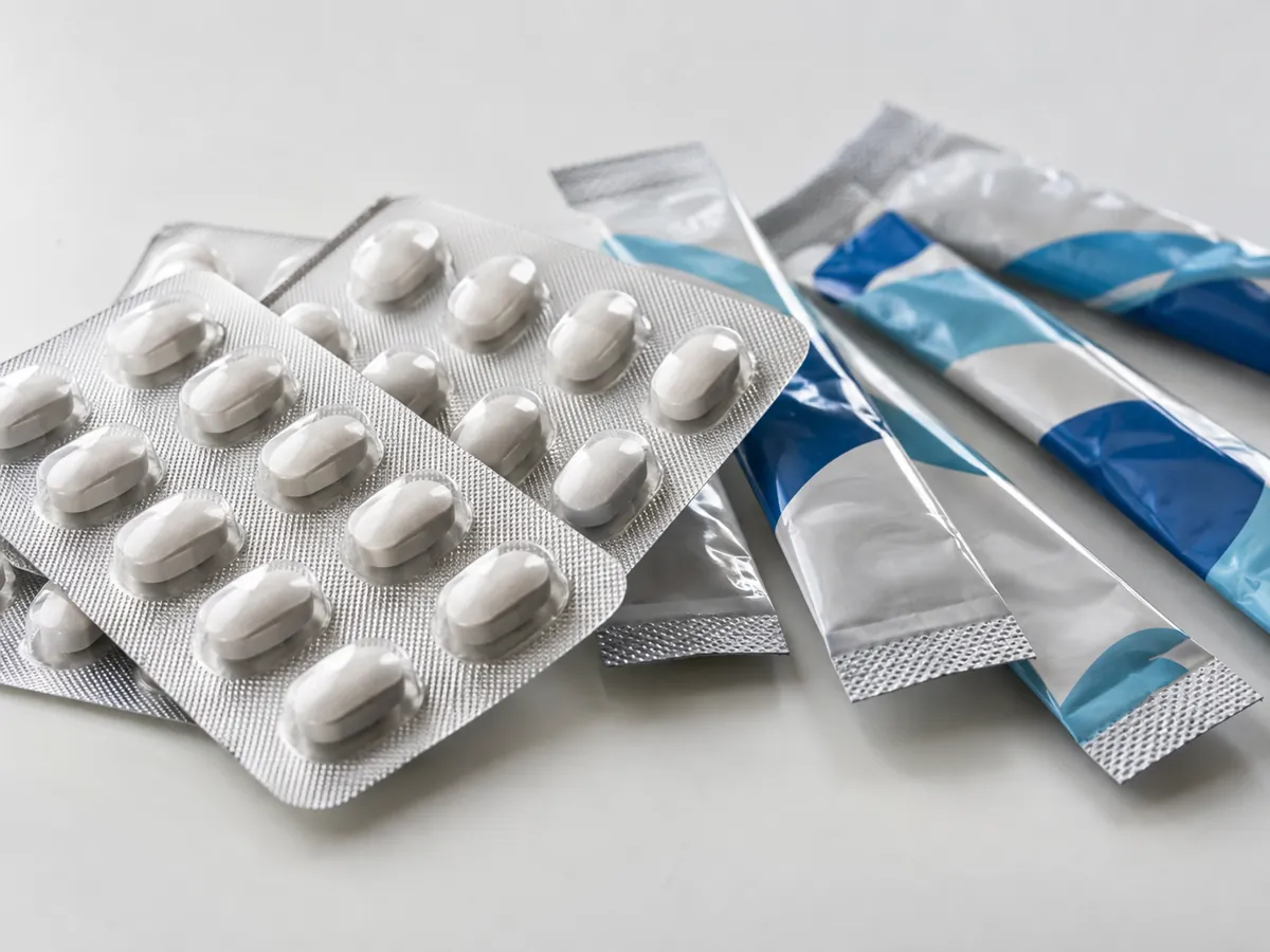 Foil strip packs of tablets and stick-pack sachets