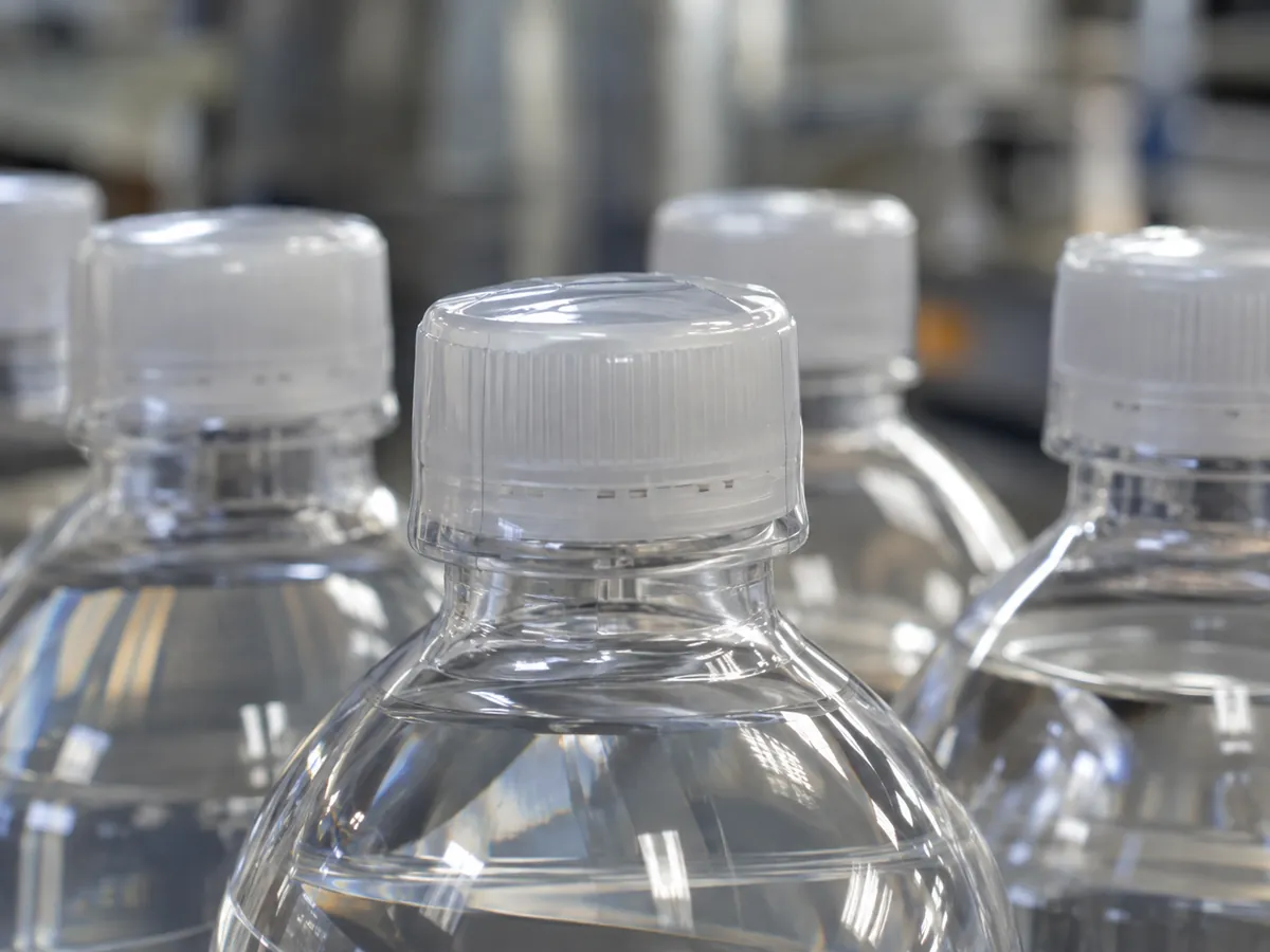 Clear shrink bands on bottle caps and necks